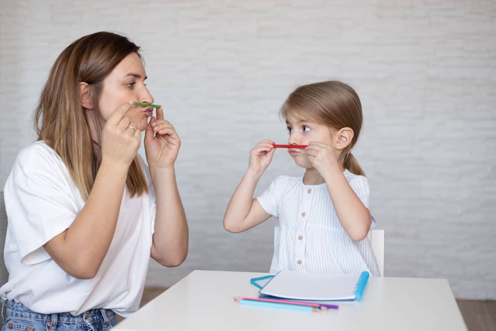 Speech,Therapy,For,Kids.,Young,Woman,And,Little,Girl,Make