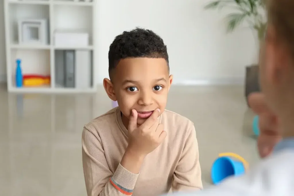 Little boy with speech therapist